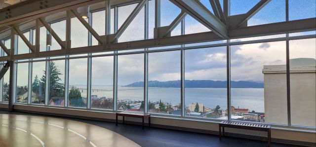 A photo of a wide window showcasing a view of the Columbia River