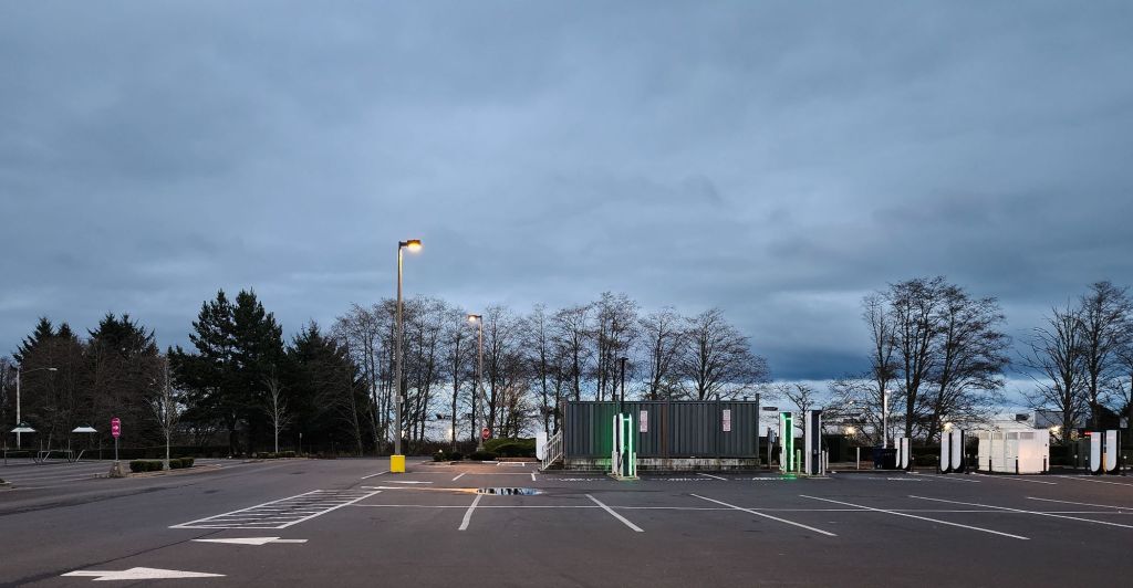 an electric car charging station in an empty parking lot