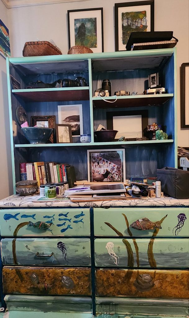 a bureau painted to look like an underwater scene